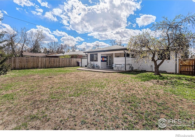 2566 S Stuart St, Denver, CO 80219 - back of house featuring a patio