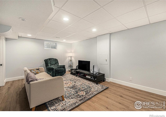 2566 S Stuart St, Denver, CO 80219 - living area with wood finished floors, baseboards, a drop ceiling, and recessed lighting