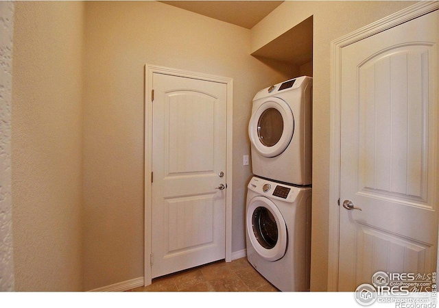 1693 Grand Ave Unit 1, Windsor, CO 80550 - laundry area featuring stacked washing machine and dryer and baseboards