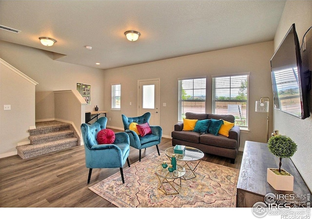 1693 Grand Ave Unit 1, Windsor, CO 80550 - living area with wood finished floors, stairs, and baseboards