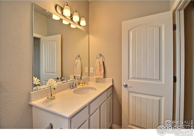 1693 Grand Ave Unit 1, Windsor, CO 80550 - bathroom with a textured wall and vanity