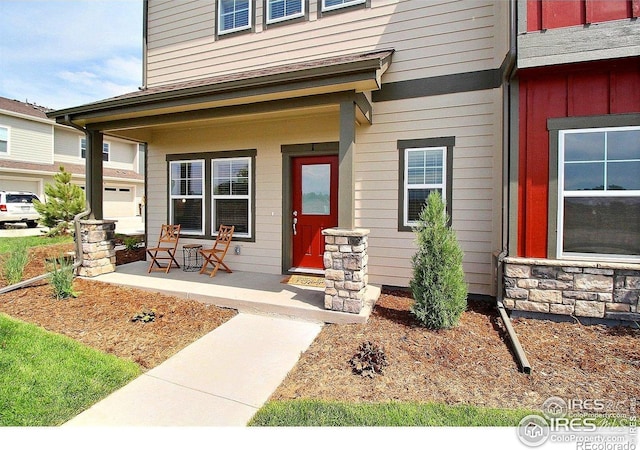 1693 Grand Ave Unit 1, Windsor, CO 80550 - entrance to property featuring covered porch and board and batten siding