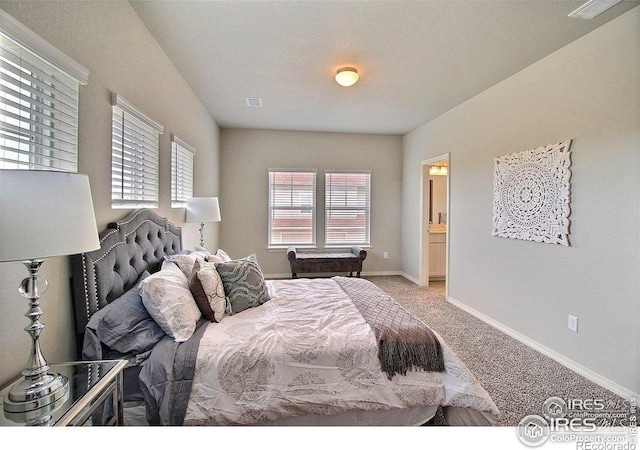1693 Grand Ave Unit 1, Windsor, CO 80550 - bedroom with carpet floors, baseboards, and connected bathroom