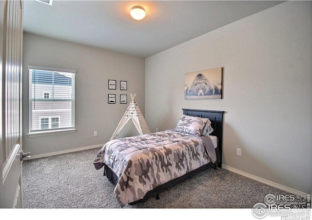 1693 Grand Ave Unit 1, Windsor, CO 80550 - bedroom featuring carpet floors and baseboards