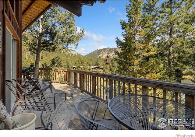 741 Hickory Dr, Lyons, CO 80540 - deck with outdoor dining space and a mountain view