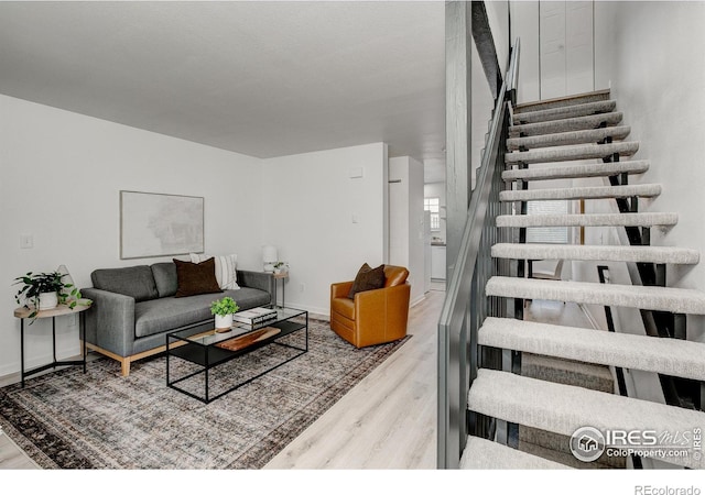 3200 Azalea Dr Unit 5, Fort Collins, CO 80526 - living area featuring wood finished floors, stairs, and baseboards
