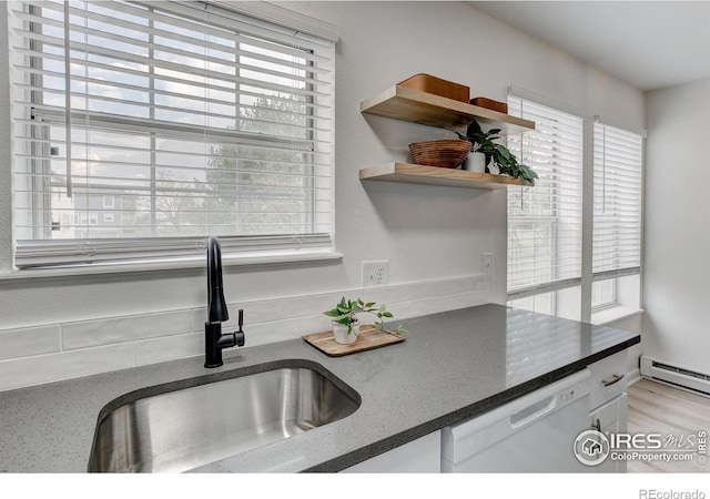 3200 Azalea Dr Unit 5, Fort Collins, CO 80526 - kitchen featuring a sink, dishwasher, plenty of natural light, and white cabinets