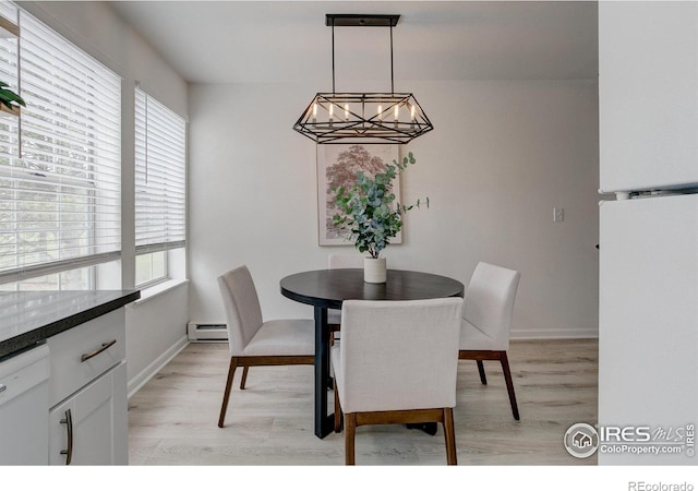3200 Azalea Dr Unit 5, Fort Collins, CO 80526 - dining area with a baseboard radiator, a chandelier, light wood-style flooring, and baseboards