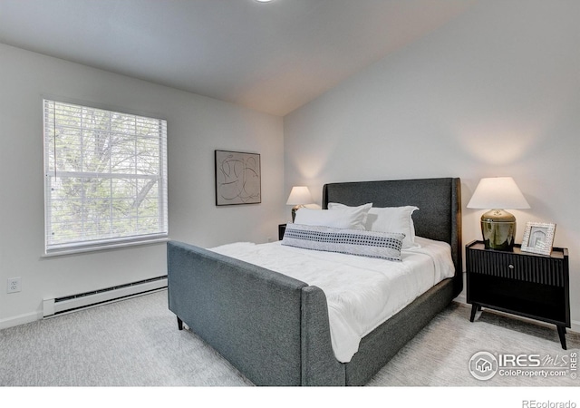 3200 Azalea Dr Unit 5, Fort Collins, CO 80526 - bedroom with baseboard heating, carpet flooring, baseboards, and vaulted ceiling