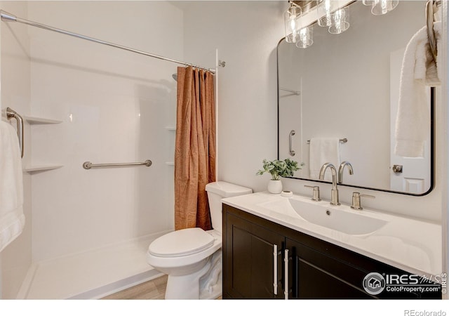3200 Azalea Dr Unit 5, Fort Collins, CO 80526 - bathroom featuring toilet, vanity, and a shower with curtain