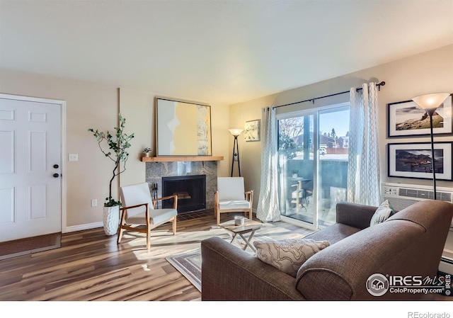 695 Manhattan Dr Unit 22, Boulder, CO 80303 - living room with a premium fireplace, wood finished floors, and baseboards