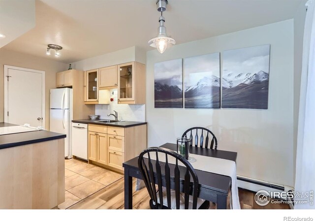 695 Manhattan Dr Unit 22, Boulder, CO 80303 - dining room featuring a baseboard heating unit and light wood-type flooring