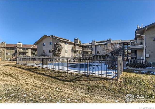 695 Manhattan Dr Unit 22, Boulder, CO 80303 - community pool featuring fence, a patio area, and a residential view