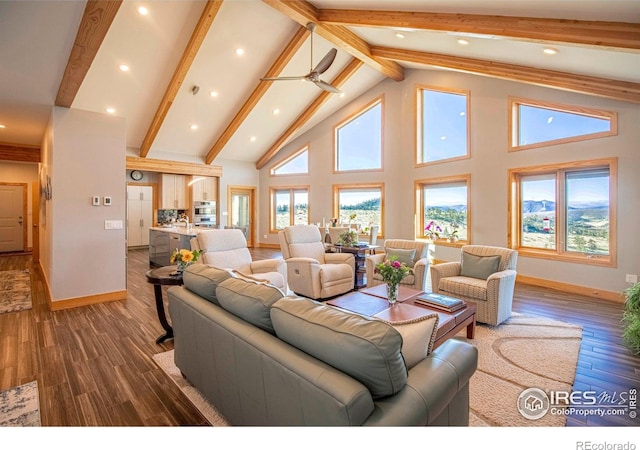 91 Eagle Rising Pl, Livermore, CO 80536 - living room with beamed ceiling, wood finished floors, high vaulted ceiling, baseboards, and recessed lighting