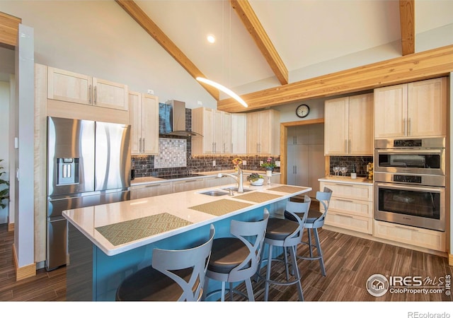 91 Eagle Rising Pl, Livermore, CO 80536 - kitchen with appliances with stainless steel finishes, wall chimney exhaust hood, a sink, light brown cabinetry, and dark wood-style flooring