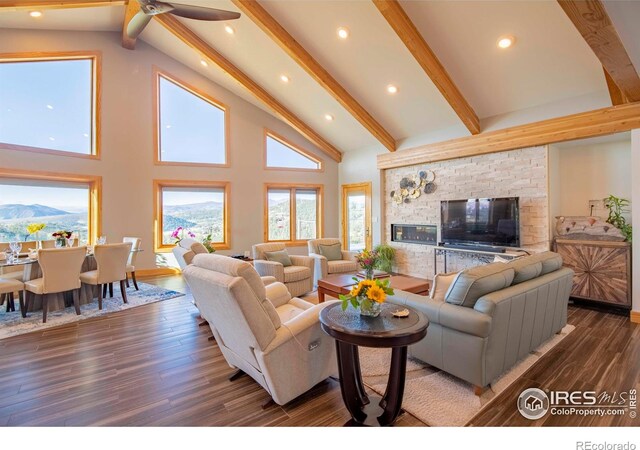 91 Eagle Rising Pl, Livermore, CO 80536 - living area with beam ceiling, wood finished floors, high vaulted ceiling, recessed lighting, and a ceiling fan
