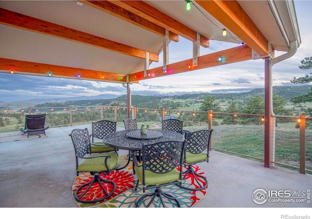 91 Eagle Rising Pl, Livermore, CO 80536 - view of patio with a mountain view and outdoor dining space