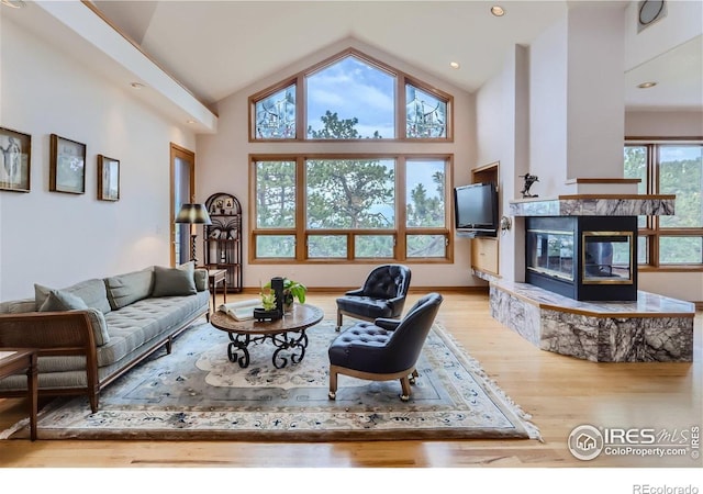 36 High View Dr, Boulder, CO 80304 - living area with wood finished floors, a high end fireplace, and high vaulted ceiling