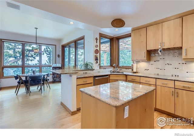 36 High View Dr, Boulder, CO 80304 - kitchen featuring light brown cabinets, stainless steel dishwasher, a peninsula, light wood-style flooring, and light stone countertops