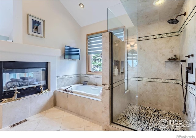 36 High View Dr, Boulder, CO 80304 - full bathroom featuring a bath, a stall shower, vaulted ceiling, tile patterned floors, and recessed lighting