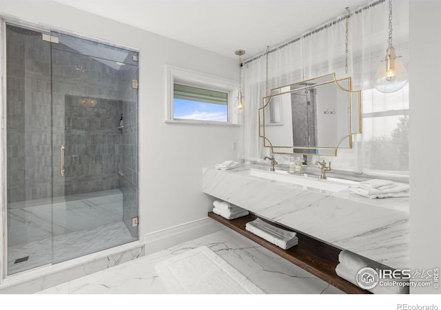 full bath featuring a shower stall, marble finish flooring, baseboards, and vanity