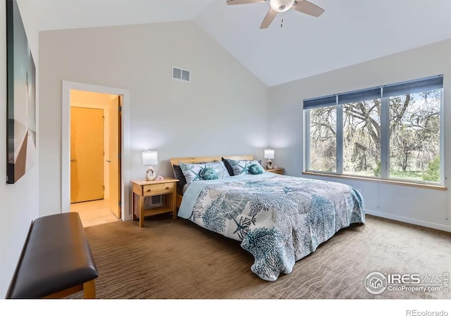 carpeted bedroom featuring a ceiling fan, visible vents, and high vaulted ceiling