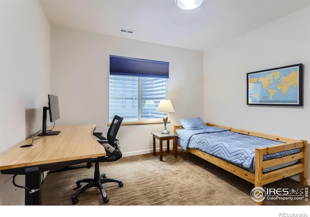 carpeted bedroom featuring baseboards and visible vents
