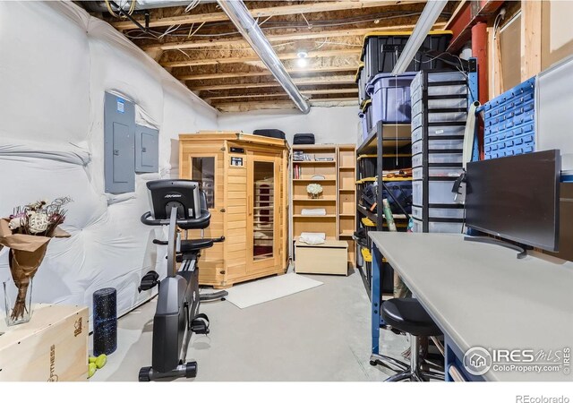 interior space with concrete flooring and electric panel