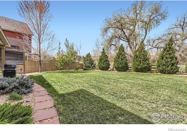 view of yard featuring fence