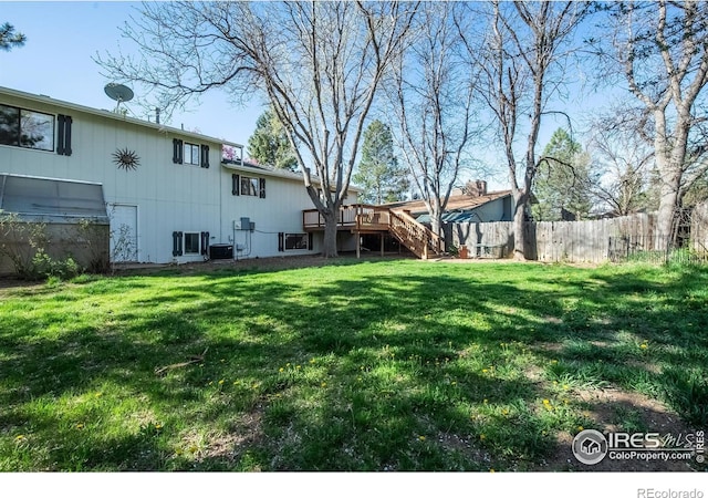 910 Sparta Dr, Lafayette, CO 80026 - view of yard with stairway, a wooden deck, and fence
