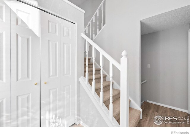 910 Sparta Dr, Lafayette, CO 80026 - staircase with wood finished floors
