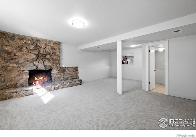910 Sparta Dr, Lafayette, CO 80026 - finished basement featuring visible vents, a fireplace, and carpet floors