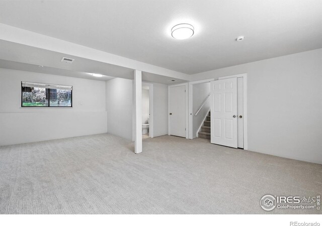 910 Sparta Dr, Lafayette, CO 80026 - basement featuring stairway, visible vents, and carpet floors