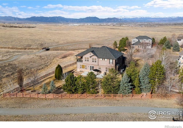 birds eye view of property with a mountain view and a rural view