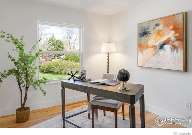 office area with wood finished floors and baseboards