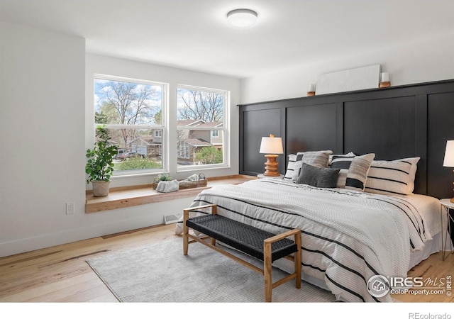 bedroom featuring wood finished floors