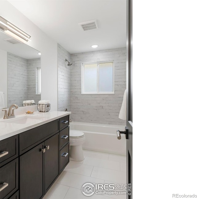 bathroom featuring tile patterned floors, shower / washtub combination, visible vents, toilet, and vanity