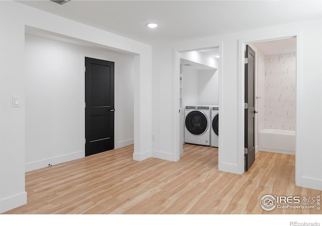 laundry room with separate washer and dryer, light wood-type flooring, baseboards, laundry area, and recessed lighting