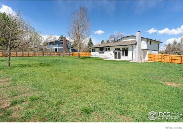 view of yard with a fenced backyard