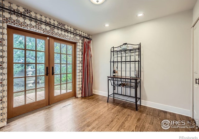 3707 Shelter Cv, Fort Collins, CO 80525 - doorway with french doors, baseboards, wood finished floors, and recessed lighting