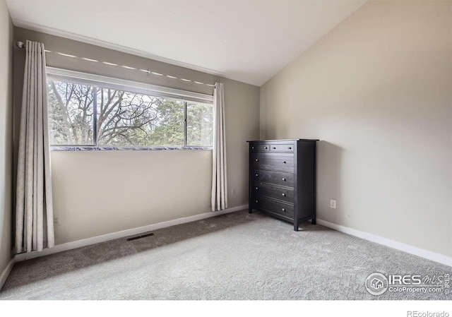 3707 Shelter Cv, Fort Collins, CO 80525 - unfurnished bedroom with carpet, lofted ceiling, and baseboards