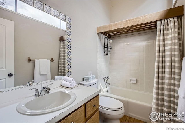 3707 Shelter Cv, Fort Collins, CO 80525 - bathroom with vanity, shower / bath combination with curtain, toilet, and wood finished floors