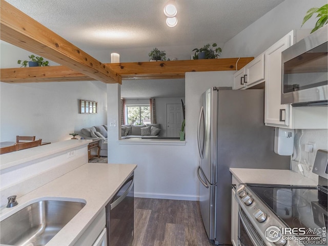 13146 Raritan Ct, Westminster, CO 80234 - kitchen with light countertops, stainless steel appliances, white cabinetry, and a sink