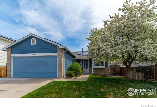 13146 Raritan Ct, Westminster, CO 80234 - single story home featuring solar panels, a front yard, a garage, fence, and concrete driveway