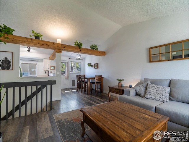 13146 Raritan Ct, Westminster, CO 80234 - living area with a textured ceiling, wood finished floors, and lofted ceiling