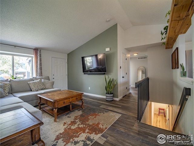 13146 Raritan Ct, Westminster, CO 80234 - living room featuring a textured ceiling, visible vents, vaulted ceiling, wood finished floors, and baseboards