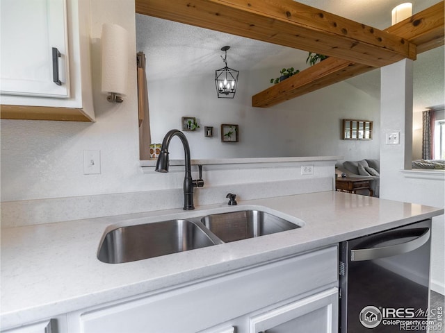 13146 Raritan Ct, Westminster, CO 80234 - kitchen with a sink, dishwasher, white cabinetry, open floor plan, and pendant lighting