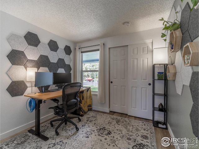 13146 Raritan Ct, Westminster, CO 80234 - home office with baseboards, a textured ceiling, and wood finished floors