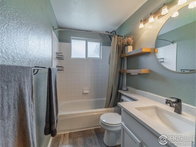 13146 Raritan Ct, Westminster, CO 80234 - full bath with toilet, a textured wall, wood finished floors, and shower / bath combo