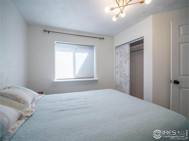 13146 Raritan Ct, Westminster, CO 80234 - bedroom with a closet and a notable chandelier